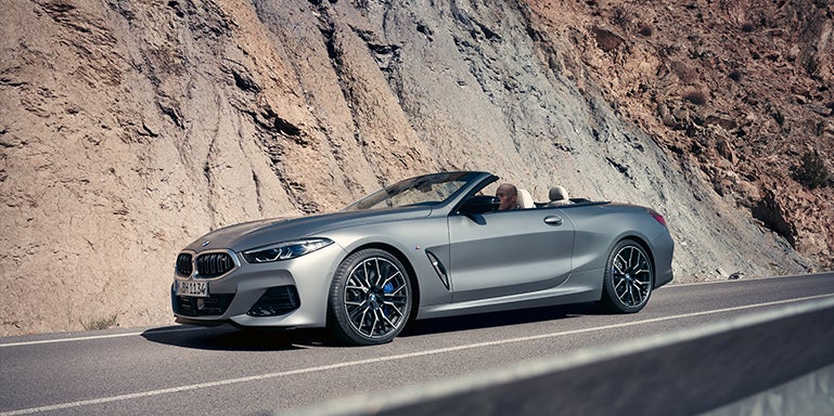 Grey BMW convertible driving around a mountain | DARCARS BMW of Mt. Kisco in Mt. Kisco NY